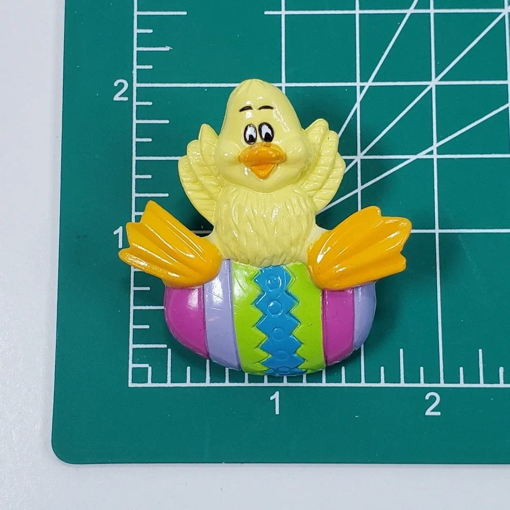 Vintage Plastic Yellow Duck Sitting On a Colorful Easter Egg Spring Brooch Pin